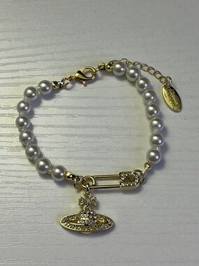 Vivienne Westwood Gold-Tone Pearl Charm Bracelet with Orb Pendant